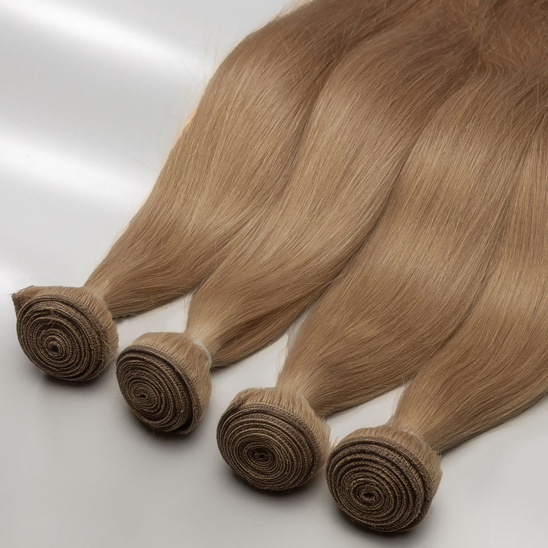 Hand-tied weft extensions